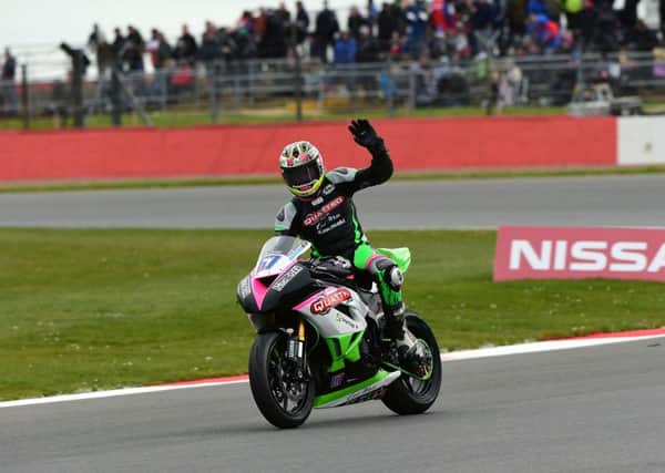 Andy Reid celebrates his British Supersport victory at Silverstone.