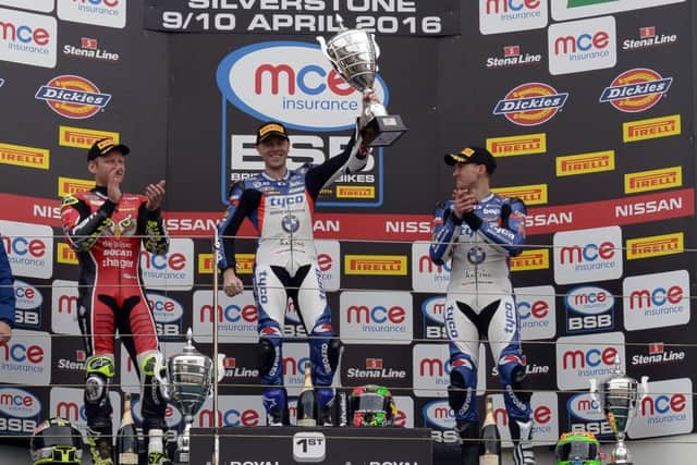 Michael Laverty celebrates his British Superbike victory with Shane Byrne (left) and his Tyco BMW team-mate Christian Iddon at Silverstone.