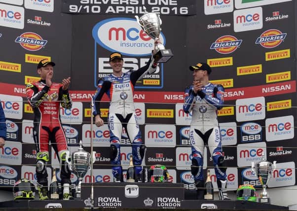 Michael Laverty celebrates his British Superbike victory with Shane Byrne (left) and his Tyco BMW team-mate Christian Iddon at Silverstone.