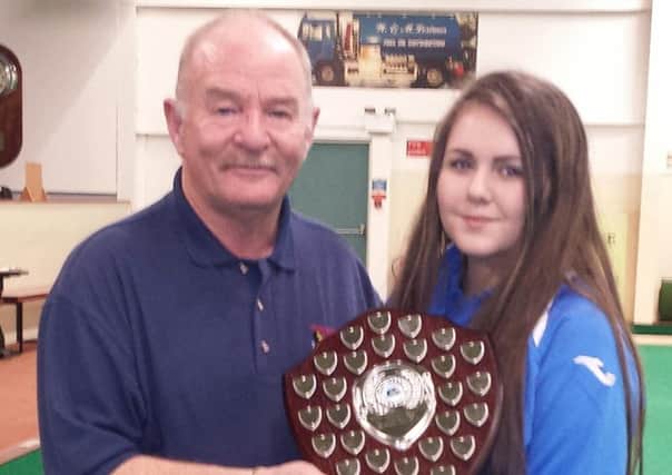 Rod Coleman presenting the North West Captain Shauna O'Neill with the Junior Match play shield.