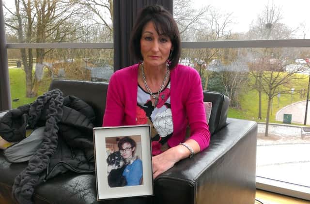 Colette Snoddy holding a picture of her son, Matthew, who tragically took his own life in May 2015