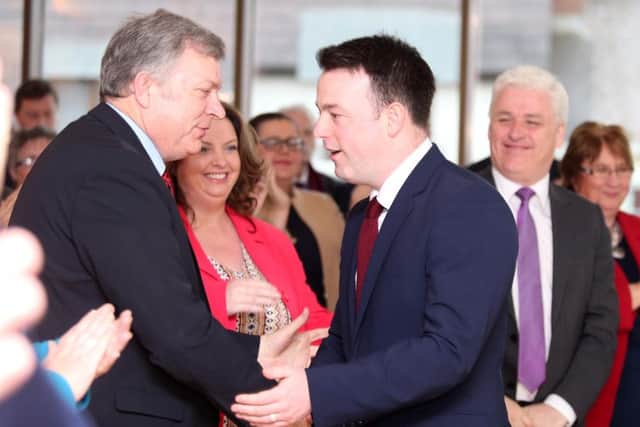 SDLP leader Colum Eastwood (right) shakes hands with colleague Patsy McGlone after his speech at the party's manifesto launch. 
Picture: Jonathan Porter/PressEye