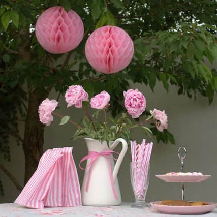 Pink honeycomb paper party balls, available from ellajames.co.uk