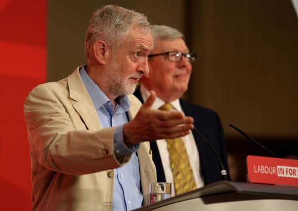 Labour party leader Jeremy Corbyn on stage with Alan Johnson (right) as he delivers a Remain speech on the EU referendum campaign at Senate House, London on Thursday. Photo: Chris Radburn/PA Wire