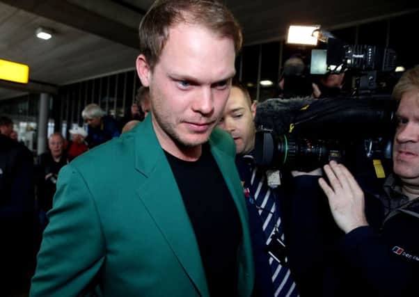 Danny Willett arrives at Manchester Airport after his victory at The Masters