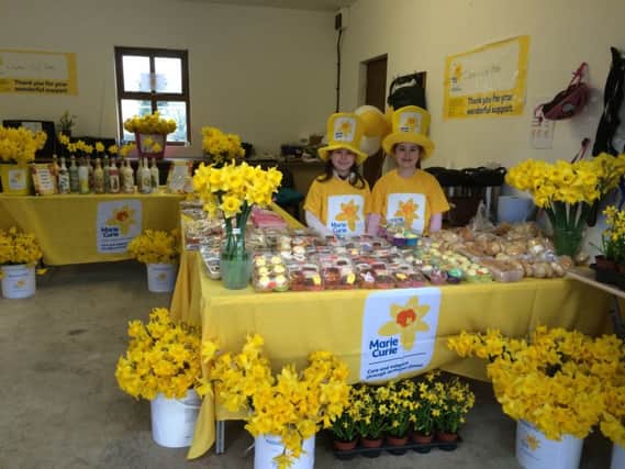 Lauren and Lily Bates, aged eight and six, who raised money for Marie Curie