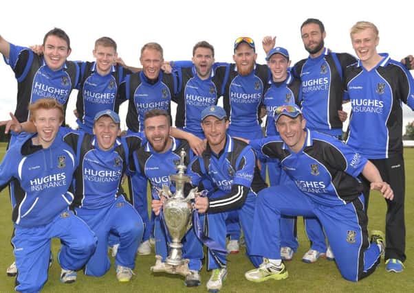 Mandatory Credit:  Rowland White/PressEye
Cricket: Ulster Bank Challenge Cup Final
Teams: CIYMS (blue) v Instonians (black)
Venue: The Green, Comber
Date: 1st August  2015
Caption: The victorious CIYMS team celebrate