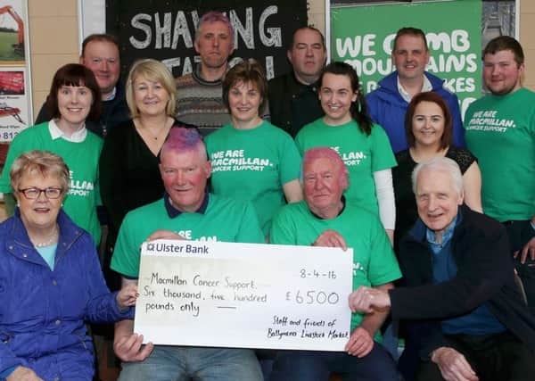 Jim Beggs, Yard Supervisor Ballymena Mart with staff and customers who raised an impressive Â£6500 for Macmillan Cancer Support recently when they braved the Shaving Station set up at the Mart for a cut, colour and style!