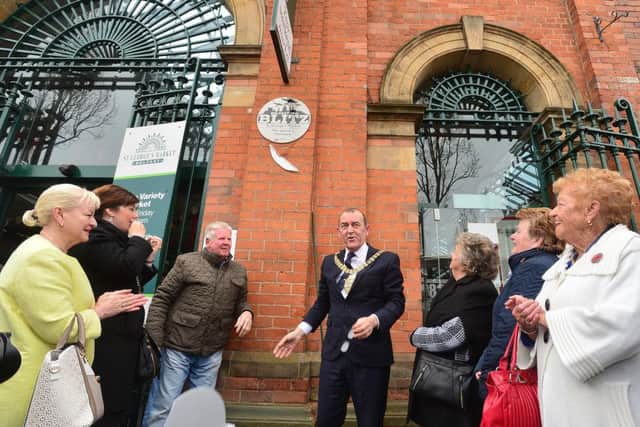 Lord Mayor of Belfast, councillor Arder Carson unveiling the first of a number of plaques planned for key Belfast blitz locations