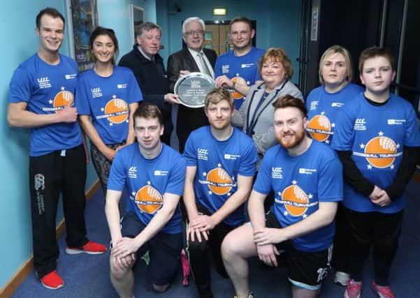 'Dodgeball Plate' winners Danske Bank are pictured with: (l-r) Alderman Paul Porter, Chairman of the Council's Leisure & Community Development Committee; Alderman Allan Ewart, Chairman of the Council's Development Committee and Barbara Porter, Health and Wellbeing Improvement Senior Officer for the Public Health Agency.