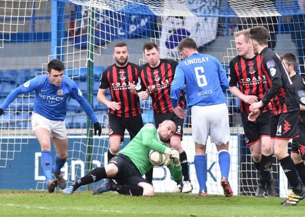 Crusaders goalkeeper Sean O'Neill thwarts this Glenavon attack