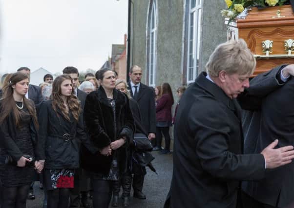 Desperately sad scenes as John Irwin's coffin is carried from the church.