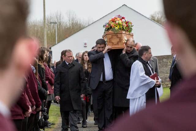 Friends and relatives at the funeral of John Irwin at St. John's Parish Church, Middletown, Co Armagh
