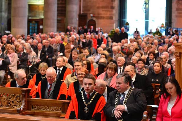 Paul Bell, mayor of Drogheda, middle front row, beside Belfast deputy mayor Guy Spence, in front of councillors and members of the public,  at the St Annes service