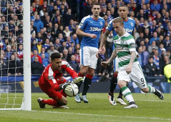Rangers' Wes Foderingham makes a save at the feet of Celtic's Leigh Griffiths