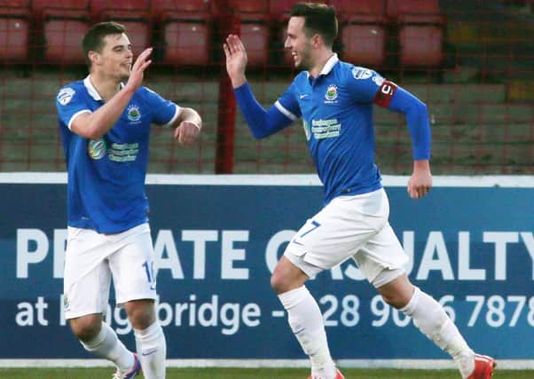 Linfield captain Andrew Waterworth celebrates after scoring