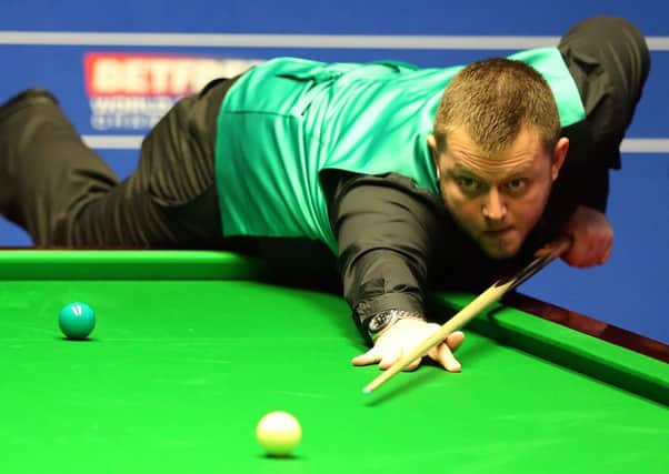 Mark Allen in action against Mitchell Mann during day four of the Betfred Snooker World Championships