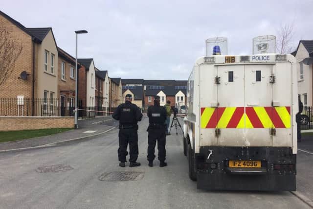 P.S.N.I. officers at the scene of the shooting in Creggan.