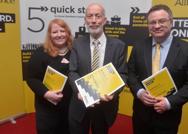 Alliance Leader David Ford  with Naomi Long and Stephen Farry  during their manifesto launch at the Park Avenue Hotel in East Belfast for the forthcoming Assembly election