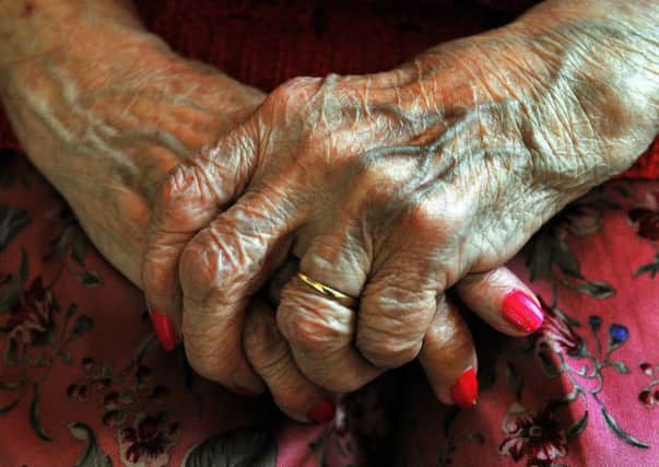 The hands of an elderly resident at a nursing home