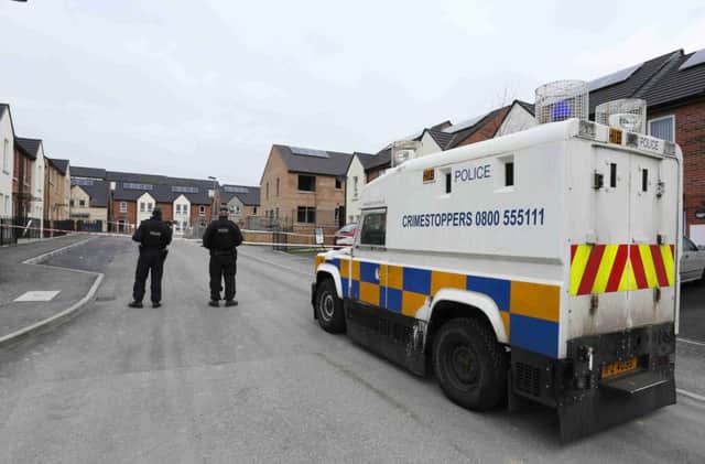 Police at the scene in Magowan Park, Creggan, Londonderry yesterday after a man was shot twice in the leg