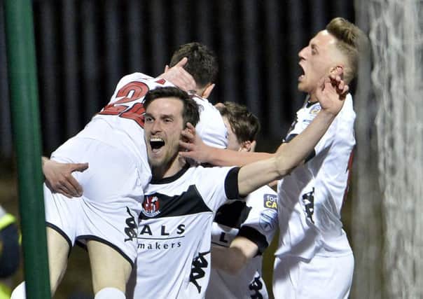 Crusaders Paul Heatley celebrates after he scores against Cliftonville