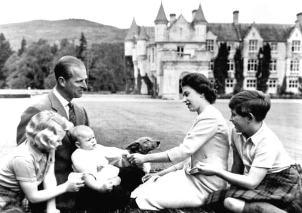 File photo dated 08/09/60 of members of the royal family playing with Prince Andrew in the grounds of Balmoral, as Scotland has remained a special place for the Queen throughout her 90 years, home to key events, regular visits and - of course - family holidays