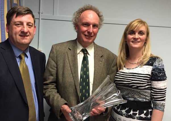 Presentation to Campbell Tweed OBE for services to Lantra (left to right) Marcus Potter, Campbell Tweed and Paula Smyth