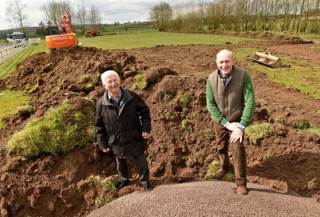 Tyrone Farming Society chairman Alan Kyle and secretary Edwin Cartwright on site as work begins on new equestrian training arena which will be completed in time for this years Omagh Show at the beginning of July.