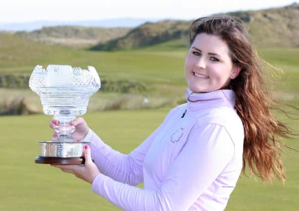 Olivia Mehaffey shows off the trophy after easing to victory at the Irish Womens Open Stroke Play Championship