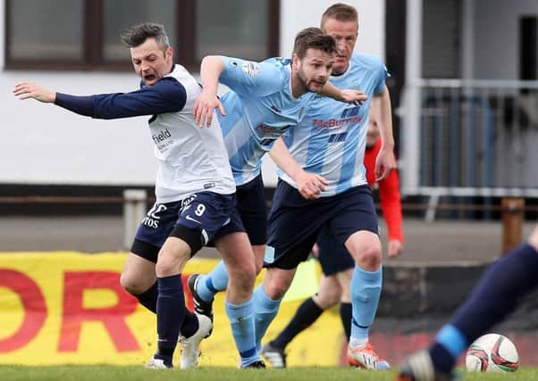 Ballymena United defender Nathan Hanley battles for the ball with Ballinamallard's Ivan Sproule during today's Danske Bank Premiership game at the Showgrounds. Picture: Press Eye.