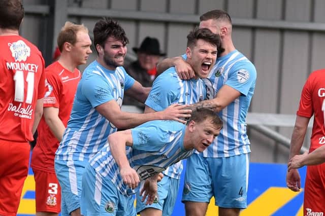 Warrenpoint's Conor McDonald
 celebrates after scoring to make it 1-0
 against Portadown