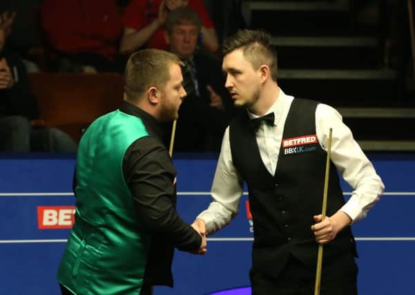Mark Allen shakes hands with Kyren Wilson after losing at the World Championships