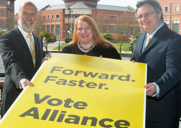 Naomi Long, centre, with 
Alliance Party leader David Ford, left, and Stephen Farry at the launch this month for the party's candidates in the Assembly elections. 
Pic Pacemaker