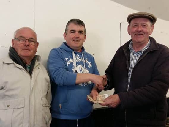 The Wright team receive DTW from Lurgan Social chairman Kevin Henderson