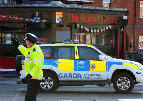 Garda outside The Sunset House bar in Dublin where a man has been shot dead in a gangland style murder that was immediately linked to a devastating underworld feud