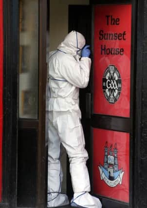 Garda forensics at The Sunset House bar in Dublin where a man has been shot dead in a gangland style murder that was immediately linked to a devastating underworld feud
