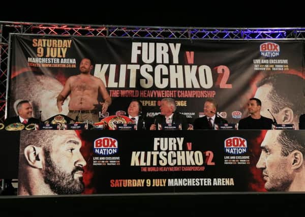 Tyson Fury with his t-shirt off during the press conference Manchester Arena, Manchester