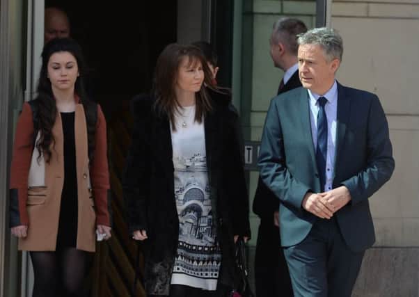 Peter Dolan and family leave Laganside Court on Wednesday