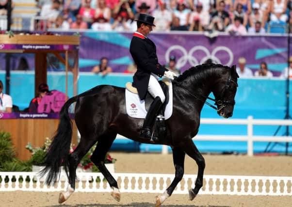 Great Britain's Carl Hester riding Uthopia during the 2012 London Olympics