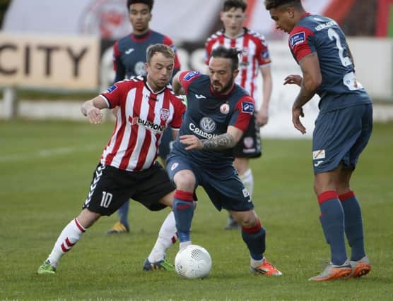 Derry's Keith Ward in action with Sligo's goalscorer, Raffaele Cretaro