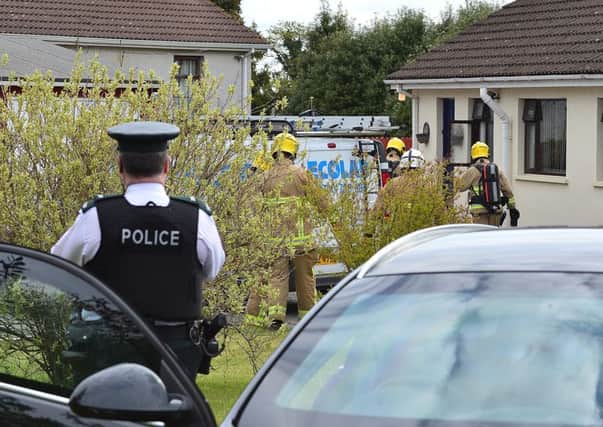 Police and the emergency services at the dead man's house on Saturday as the investigation into the tragedy began