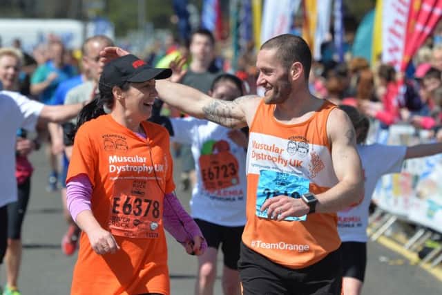 Louise James runs with Tommy McCallion (former Coleraine footballer. 
Photo Colm Lenaghan/Pacemaker
