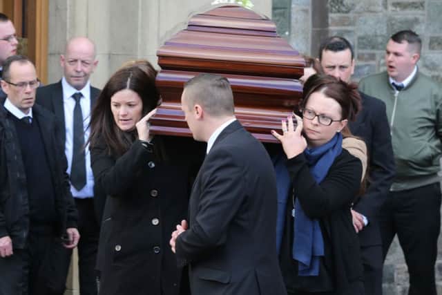 Sister Clare Crockett's coffins is taken out of Long Tower Church in Londonderry following her funeral