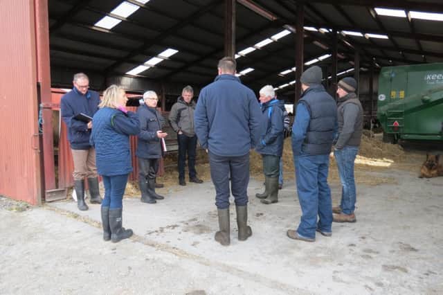 Pictured discussing the flooding with effected farmers and UFU president Barclay Bell is Alan Strong, independent chair of the flooding review panel set up by the Rivers Agency.