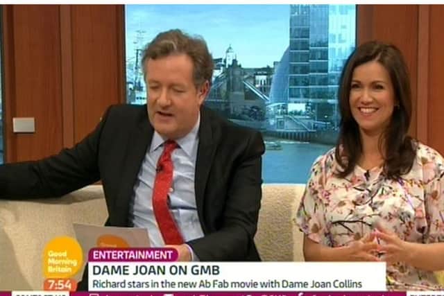Video grab taken from ITV1 of Good Morning Britain hosts Piers Morgan and Susanna Reid, who suffered a wardrobe double-up with Dame Joan Collins