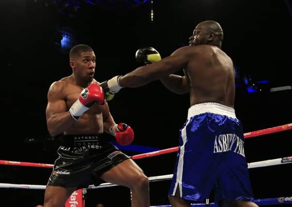 Anthony Joshua (left) in action with Kevin Johnson