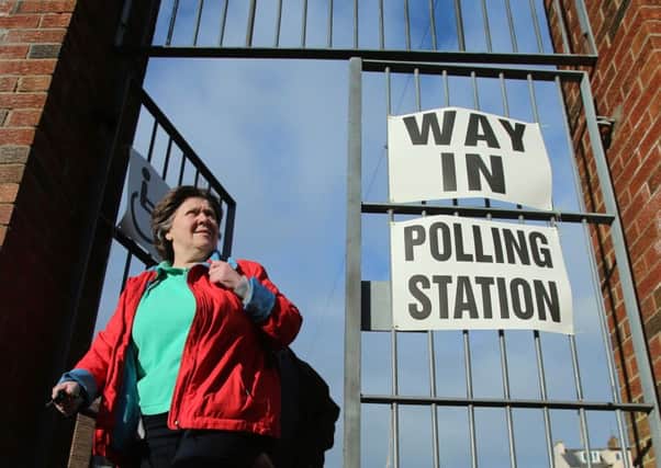 Voters outside a polling station at Model Primary School in Londonderry, as people born after Northern Ireland's historic Good Friday Agreement will get their first chance to vote today as polls open for the Stormont Assembly election