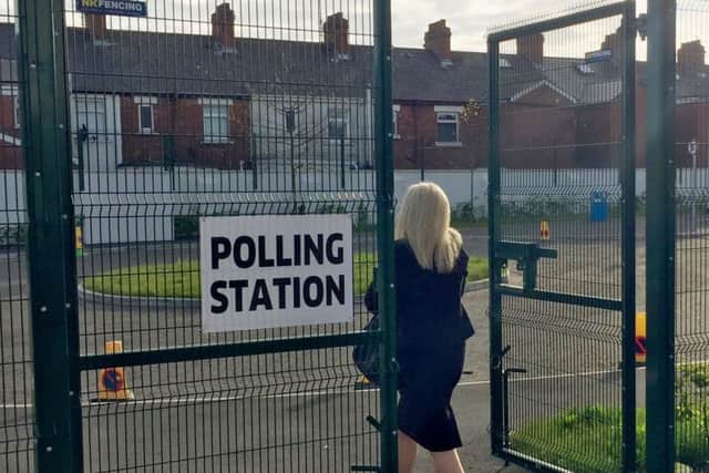Early voters arrive at a polling station in Sydenham, east Belfast