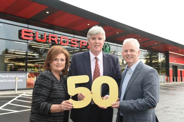 Store owners Gail Boyd and Niall Creighton, centre, with Paddy Doody, sales and marketing director with the Genderson Group